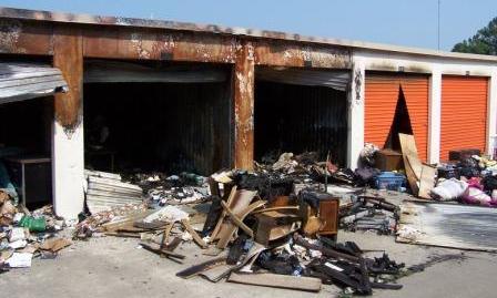 Fire damaged goods strewn about the parking lot