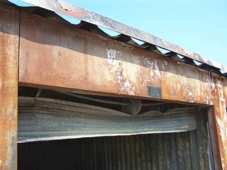 Fire damage to door, building, structure and roof