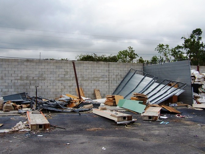 Emergency Response to clear damage from building destroyed by Hurricane.